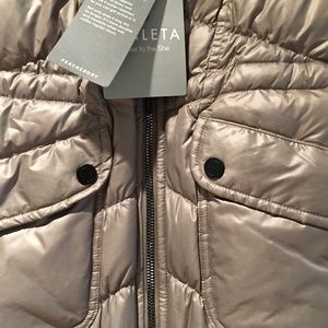 The brand Athleta.  A down jacket